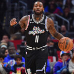 Dec 17, 2022; Los Angeles, California, USA; Los Angeles Clippers guard John Wall (11) moves the ball against the Washington Wizards during the first half at Crypto.com Arena.