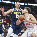 Sengun Jokic Nov 24, 2023; Houston, Texas, USA; Houston Rockets center Alperen Sengun (28) drives with the ball as Denver Nuggets center Nikola Jokic (15) defends during the first quarter at Toyota Center. Mandatory Credit: Troy Taormina-USA TODAY Sports