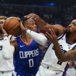 Sacramento Kings Russell Westbrook Malik Monk - Dec 6, 2023; Los Angeles, California, USA; LA Clippers guard Russell Westbrook (left) and Sacramento Kings guard Malik Monk (0) battle for the ball in first half at Crypto.com Arena. Mandatory Credit: Kirby Lee-USA TODAY Sports