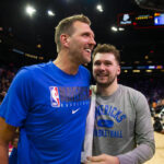 May 15, 2022; Phoenix, Arizona, USA; Dallas Mavericks oguard Luka Doncic (right) with former player Dirk Nowitzki against the Phoenix Suns in game seven of the second round for the 2022 NBA playoffs at Footprint Center.