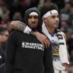 Mar 1, 2024; Toronto, Ontario, CAN; Golden State Warriors guard Gary Payton II (0) and guard Lester Quinones (25) during a break in the action against the Toronto Raptors during the second half at Scotiabank Arena.