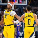 Mar 29, 2024; Indianapolis, Indiana, USA; Indiana Pacers center Myles Turner (33) and Indiana Pacers guard Tyrese Haliburton (0) celebrate in the second half against the Los Angeles Lakers at Gainbridge Fieldhouse. Mandatory Credit: Trevor Ruszkowski-USA TODAY Sports