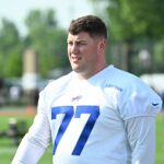 Jul 24, 2024; Rochester, NY, USA; Buffalo Bills center Will Clapp (77) walks onto the field before a training camp session at St. John Fisher University. Mandatory Credit: Mark Konezny-USA TODAY Sports