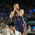 Aug 10, 2024; Paris, France; United States shooting guard Stephen Curry (4) reacts in the second half against France in the men's basketball gold medal game during the Paris 2024 Olympic Summer Games at Accor Arena.