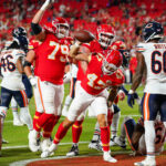 Aug 22, 2024; Kansas City, Missouri, USA; NFL; Kansas City Chiefs tight end Baylor Cupp (47) spikes the ball after scoring against the Chicago Bears during the second half at GEHA Field at Arrowhead Stadium.