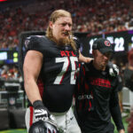 Sep 22, 2024; Atlanta, Georgia, USA; Atlanta Falcons offensive tackle Kaleb McGary (76) leaves the field with an injury against the Kansas City Chiefs in the second quarter at Mercedes-Benz Stadium. Mandatory Credit: Brett Davis-Imagn Images