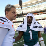 Oct 27, 2024; Cincinnati, Ohio, USA; NFL; Cincinnati Bengals quarterback Joe Burrow (9) and Philadelphia Eagles quarterback Jalen Hurts (1) meet after the game Paycor Stadium.