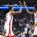Oct 31, 2024; Dallas, Texas, USA; Houston Rockets forward Jabari Smith Jr. (10) celebrates with Houston Rockets forward Amen Thompson (1) during the first half against the Dallas Mavericks at American Airlines Center.
