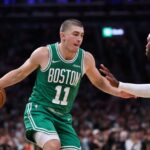 Jrue Holiday Payton Pritchard Celtics Nov 6, 2024; Boston, Massachusetts, USA; Boston Celtics guard Payton Pritchard (11) dribbles down the court during the first half against the Golden State Warriors at TD Garden. Mandatory Credit: Paul Rutherford-Imagn Images