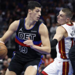 Nov 12, 2024; Detroit, Michigan, USA; Detroit Pistons forward Simone Fontecchio (19) dribbles defended by Miami Heat guard Tyler Herro (14) in the second half at Little Caesars Arena.