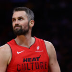 Nov 18, 2024; Miami, Florida, USA; Miami Heat forward Kevin Love (42) looks on against the Philadelphia 76ers during the third quarter at Kaseya Center.