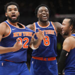Dec 9, 2024; Toronto, Ontario, CAN; New York Knicks guard Jalen Brunson (11) and forward OG Anunoby (8) react after a three point basket by center Karl-Anthony Towns (32) to clinch a win over the Toronto Raptors during the second half at Scotiabank Arena.