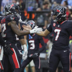 Dec 15, 2024; Houston, Texas, USA; Houston Texans wide receiver Nico Collins (12) celebrates with quarterback C.J. Stroud (7) after a touchdown reception during the second quarter against the Miami Dolphins at NRG Stadium.
