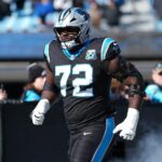 Dec 22, 2024; Charlotte, North Carolina, USA; Carolina Panthers offensive tackle Taylor Moton (72) takes the field during the first quarter against the Arizona Cardinals at Bank of America Stadium. Mandatory Credit: Jim Dedmon-Imagn Images