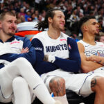 Dec 23, 2024; Denver, Colorado, USA; Denver Nuggets center Nikola Jokic (15) and forward Aaron Gordon (32) and forward Michael Porter Jr. (1) on the bench in the fourth quarter against the Phoenix Suns at Ball Arena.