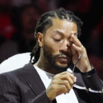 Jan 4, 2025; Chicago, Illinois, USA; Chicago Bulls and New York Knicks former player Derrick Rose reacts as he is honored at halftime of a game between the Chicago Bulls and the New York Knicks at United Center.