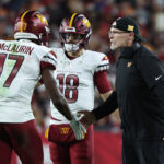 Jan 12, 2025; Tampa, Florida, USA; Washington Commanders wide receiver Terry McLaurin (17) celebrates with head coach Dan Quinn after catching a touchdown during the fourth quarter of a NFC wild card playoff against the Tampa Bay Buccaneers at Raymond James Stadium.
