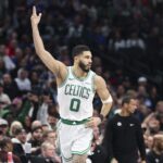 Jan 25, 2025; Dallas, Texas, USA; Boston Celtics forward Jayson Tatum (0) reacts after scoring against the Dallas Mavericks during the first half at American Airlines Center. Mandatory Credit: Kevin Jairaj-Imagn Images