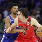 Feb 24, 2025; Philadelphia, Pennsylvania, USA; NBA; Chicago Bulls guard Josh Giddey (3) controls the ball against Philadelphia 76ers guard Quentin Grimes (5) during the first quarter at Wells Fargo Center.