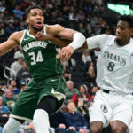 Mar 5, 2025; Milwaukee, Wisconsin, USA; Milwaukee Bucks forward Giannis Antetokounmpo (34) drives for the basket against Dallas Mavericks forward Olivier-Maxence Prosper (8) in the second quarter at Fiserv Forum.