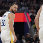 Mar 8, 2025; San Francisco, California, USA; Golden State Warriors guard Stephen Curry (30) looks at forward Gui Santos (15) after defensive stand against the Detroit Pistons in the third quarter at Chase Center. Mandatory Credit: David Gonzales-Imagn Images