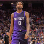 Mar 20, 2025; Sacramento, California, USA; Sacramento Kings guard Malik Monk (0) looks on during the second quarter of the game against the Chicago Bulls at Golden 1 Center.