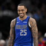 Mar 21, 2025; Dallas, Texas, USA; Dallas Mavericks forward P.J. Washington (25) smiles for the fans during the second half of the game against the Detroit Pistons at the American Airlines Center.