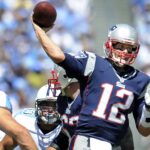 New England Patriots quarterback Tom Brady (12) throws a touchdown pass over the Tennessee Titans defense at LP Field in Nashville on Sept. 9, 2012. The Titans lost their home and season opener 34-13.