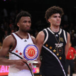 Apr 1, 2025; Brooklyn, NY, USA; McDonald's All American West guard Darryn Peterson (22) and McDonald's All American East forward Cameron Boozer (12) pose for photos after the game at Barclays Center. Mandatory Credit: Pamela Smith-Imagn Images