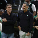 Apr 4, 2025; Boston, Massachusetts, USA; Bill Chisholm, center, who leads a group that is buying the Boston Celtics, stands with current owner Wyc Grousbeck and Chisholm’s wife, Kimberly Chisholm before the game between the Boston Celtics and the Phoenix Suns at TD Garden. Mandatory Credit: Winslow Townson-Imagn Images