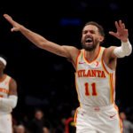 Apr 10, 2025; Brooklyn, New York, USA; Atlanta Hawks guard Trae Young (11) reacts during the third quarter against the Brooklyn Nets at Barclays Center.