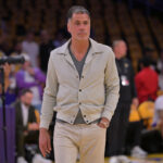 Apr 19, 2025; Los Angeles, California, USA; Los Angeles Lakers general manager Rob Pelinka walks on the couet prior to the game against the Minnesota Timberwolves at Crypto.com Arena. Mandatory Credit: Jayne Kamin-Oncea-Imagn Images