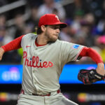 Apr 21, 2025; New York City, New York, USA; Philadelphia Phillies pitcher Aaron Nola (27) pitches against the New York Mets during the first inning at Citi Field. Mandatory Credit: John Jones-Imagn Images
