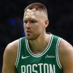 Porzingis MMA - Apr 23, 2025; Boston, Massachusetts, USA; Boston Celtics center Kristaps Porzingis (8) prepares to take a free throw after being cut by an elbow during the second half of game two of the first round of the 2024 NBA Playoffs against the Orlando Magic at TD Garden. Mandatory Credit: Winslow Townson-Imagn Images