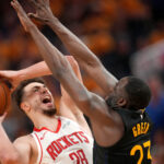 May 2, 2025; San Francisco, California, USA; Houston Rockets center Alperen Sengun (28) shoots the ball around the reach of Golden State Warriors forward Draymond Green (23) in the fourth quarter of game six of the first round for the 2025 NBA Playoffs at Chase Center.