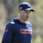 May 10, 2025; Lake Forest, IL, USA; Chicago Bears head coach Ben Johnson walks the field during rookie minicamp at Halas Hall. Mandatory Credit: David Banks-Imagn Images