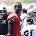 Jun 10, 2025; Henderson, NV, USA; Las Vegas Raiders quarterback Geno Smith (7) looks on during the team stretch during Las Vegas Raiders Minicamp at Intermountain Health Performance Center.