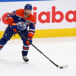 Jun 14, 2025; Edmonton, Alberta, CAN;Edmonton Oilers center Connor McDavid (97) controls the puck during the second period against the Florida Panthers in game five of the 2025 Stanley Cup Final at Rogers Place. Mandatory Credit: Sergei Belski-Imagn Images