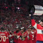 Jun 17, 2025; Sunrise, Florida, USA; Florida Panthers left wing Matthew Tkachuk (19) hoist the Stanley Cup after game six of the 2025 Stanley Cup Final against the Edmonton Oilers at Amerant Bank Arena. Mandatory Credit: Jim Rassol-Imagn Images