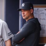 Jul 19, 2025; Atlanta, Georgia, USA; New York Yankees manager Aaron Boone (17) in the dugout before a game against the Atlanta Braves at Truist Park.