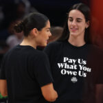 Jul 19, 2025; Indianapolis, IN, USA; Team Clark guard Caitlin Clark (22) and Team Collier guard Kelsey Plum (10) before the 2025 WNBA All Star Game at Gainbridge Fieldhouse.