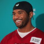 Jul 23, 2025; Miami Gardens, FL, USA; Miami Dolphins quarterback Tua Tagovailoa (1) speaks to reporters during training camp at Baptist Health Training Complex. Mandatory Credit: Sam Navarro-Imagn Images