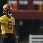 Jul 23, 2025; Ashburn, VA, USA; Washington Commanders quarterback Jayden Daniels (5) looks on during practice on day one of training camp at OrthoVirginia Training Center at Commanders Park.