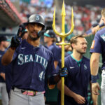 Jul 25, 2025; Anaheim, California, USA; Seattle Mariners center fielder Julio Rodriguez (44) poses for a photo in the dugout after hitting a home run during the sixth inning against the Los Angeles Angels at Angel Stadium. Mandatory Credit: Kiyoshi Mio-Imagn Images