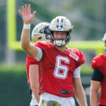 Jul 30, 2025; New Orleans, LA, USA; New Orleans Saints quarterback Tyler Shough (6) waves to fans during training camp at Ochsner Sports Performance Center. Mandatory Credit: Stephen Lew-Imagn Images