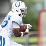 Indianapolis Colts running back Salvon Ahmed (36) runs Monday, July 28, 2025, during training camp held at Grand Park in Westfield.