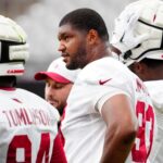 Cardinals defensive lineman Calais Campbell (93) watches his teammates from the sideline during Cardinals training camp at State Farm Stadium in Glendale, on July 31, 2025.