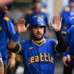 trade deadline mlb Jul 31, 2025; Seattle, Washington, USA; Seattle Mariners third baseman Eugenio Suarez (28) celebrates in the dugout after scoring a run against the Texas Rangers during the fourth inning at T-Mobile Park. Mandatory Credit: Steven Bisig-Imagn Images