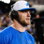 Detroit Lions defensive end Aidan Hutchinson (97) is being interviewed on the sideline during the second half of the Hall of Fame Game at Tom Benson Hall of Fame Stadium in Canton, Ohio on Thursday, July 31, 2025.