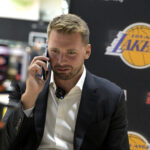 Aug 2, 2025; El Segundo, CA, USA; Los Angeles Lakers Luka Doncic (77) is interviewed by ESPN LA radio following a press conference announcing the signing of a 3-year, $165 million contract extension at UCLA Health Training Center. Mandatory Credit: Jayne Kamin-Oncea-Imagn Images